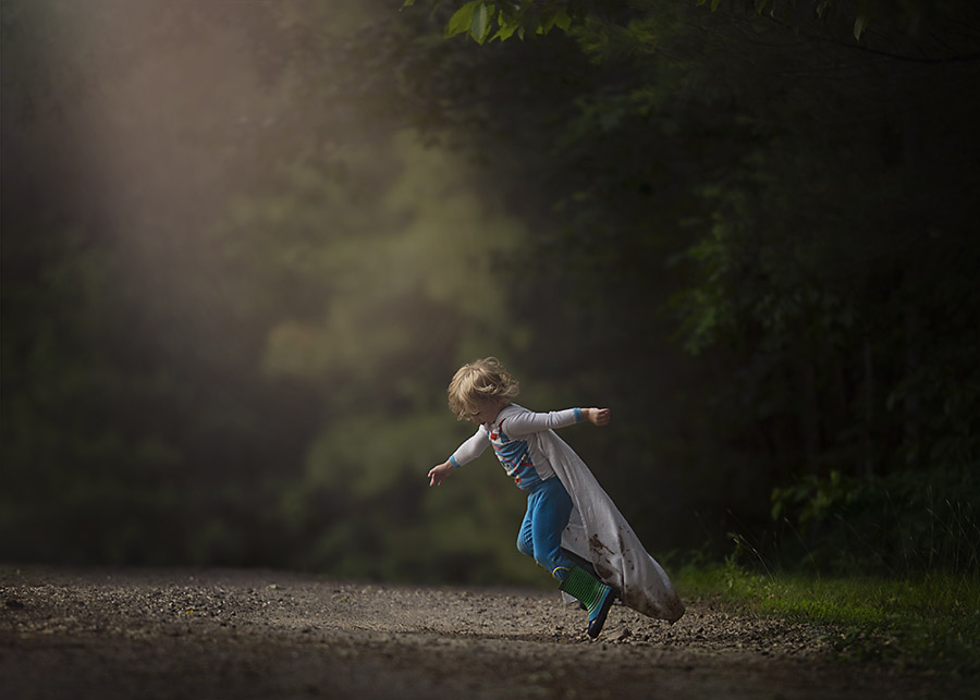Little Boy running in a cape